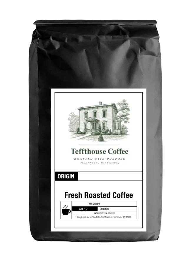 Black Teffthouse Coffee bag with a vintage illustration of the historic Tefft House and a white label reading "Roasted with Purpose" and "Fresh Roasted Coffee."